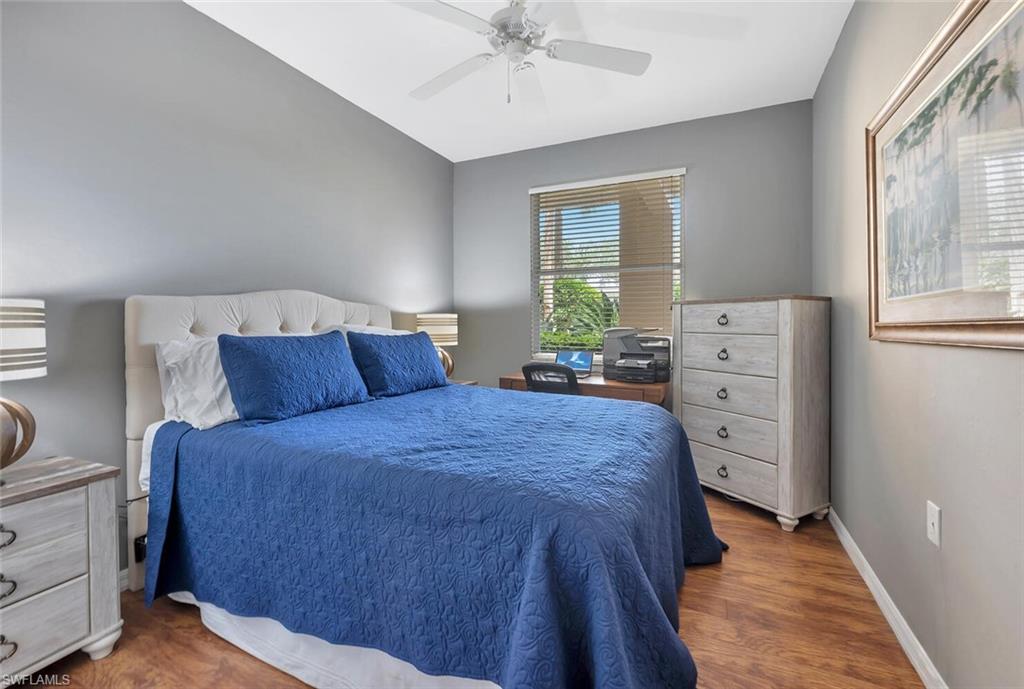 8600 Cedar Hammock Circle, Unit 1313 Naples, FL 34112 - Photo 20 of 48 a bedroom with a bed and a window