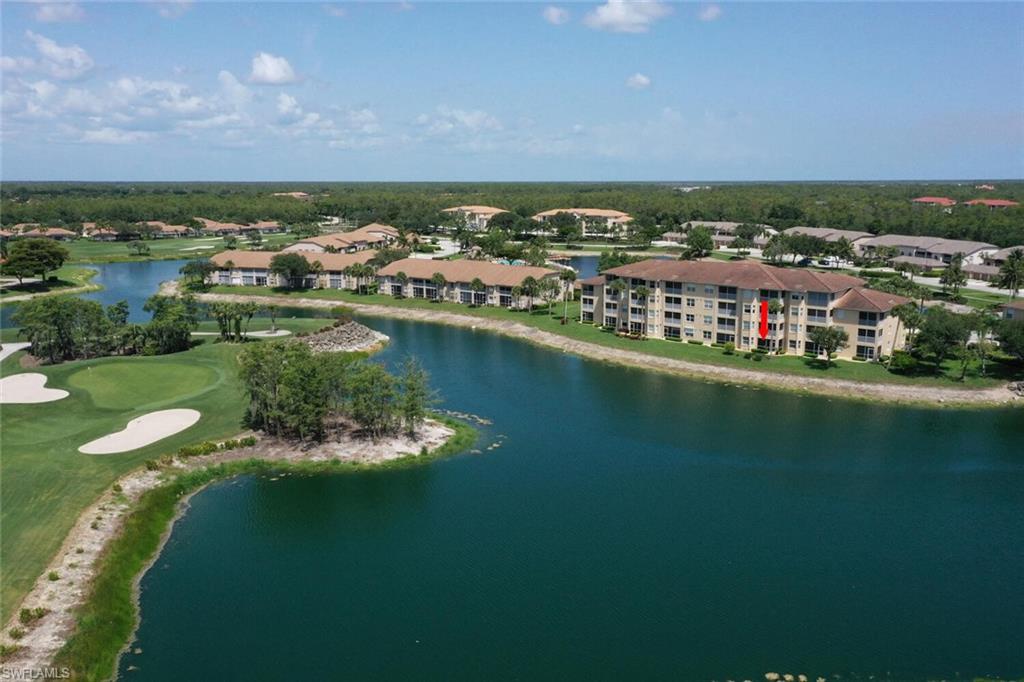 8600 Cedar Hammock Circle, Unit 1313 Naples, FL 34112 - Photo 26 of 48 an aerial view of residential houses with outdoor space and lake