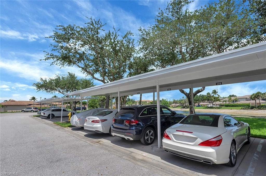 8600 Cedar Hammock Circle, Unit 1313 Naples, FL 34112 - Photo 27 of 48 a view of car parked in parking lot