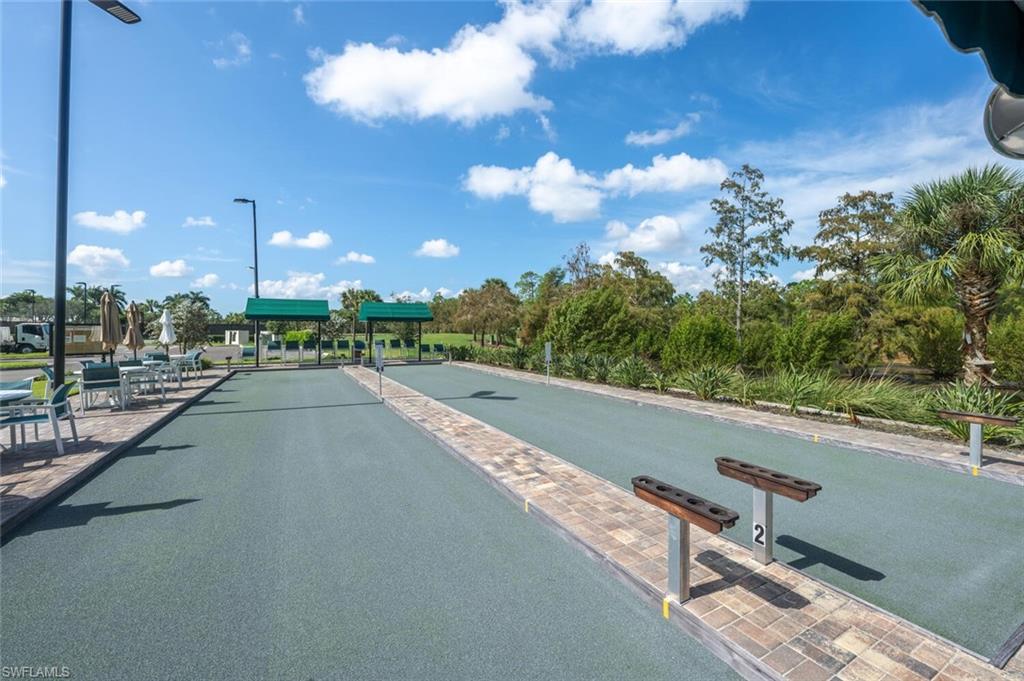 8600 Cedar Hammock Circle, Unit 1313 Naples, FL 34112 - Photo 29 of 48 a view of a street with a building in the background