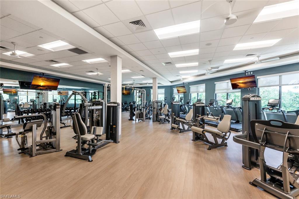 8600 Cedar Hammock Circle, Unit 1313 Naples, FL 34112 - Photo 32 of 48 a view of a room with gym equipment