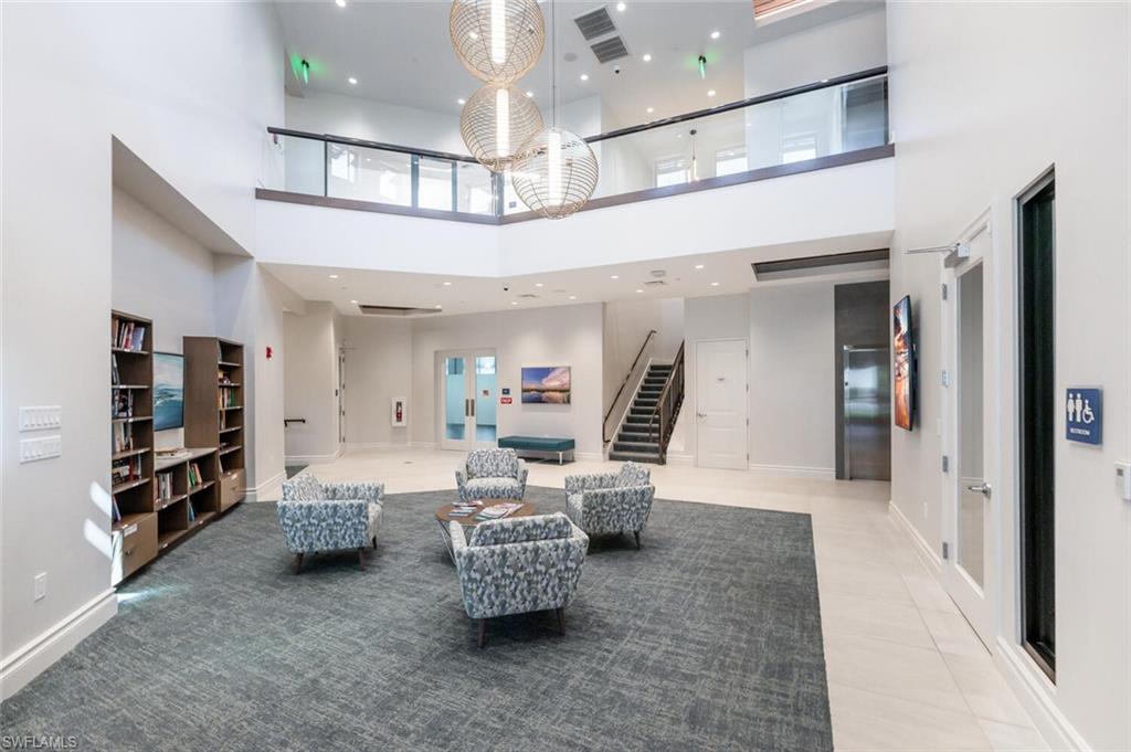 8600 Cedar Hammock Circle, Unit 1313 Naples, FL 34112 - Photo 34 of 48 a living room with furniture and a flat screen tv