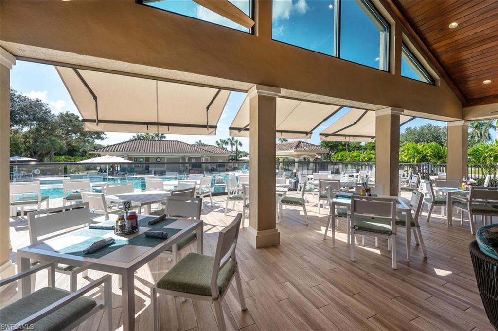 8600 Cedar Hammock Circle, Unit 1313 Naples, FL 34112 - Photo 35 of 48 a dining room with furniture wooden floor and a potted plant