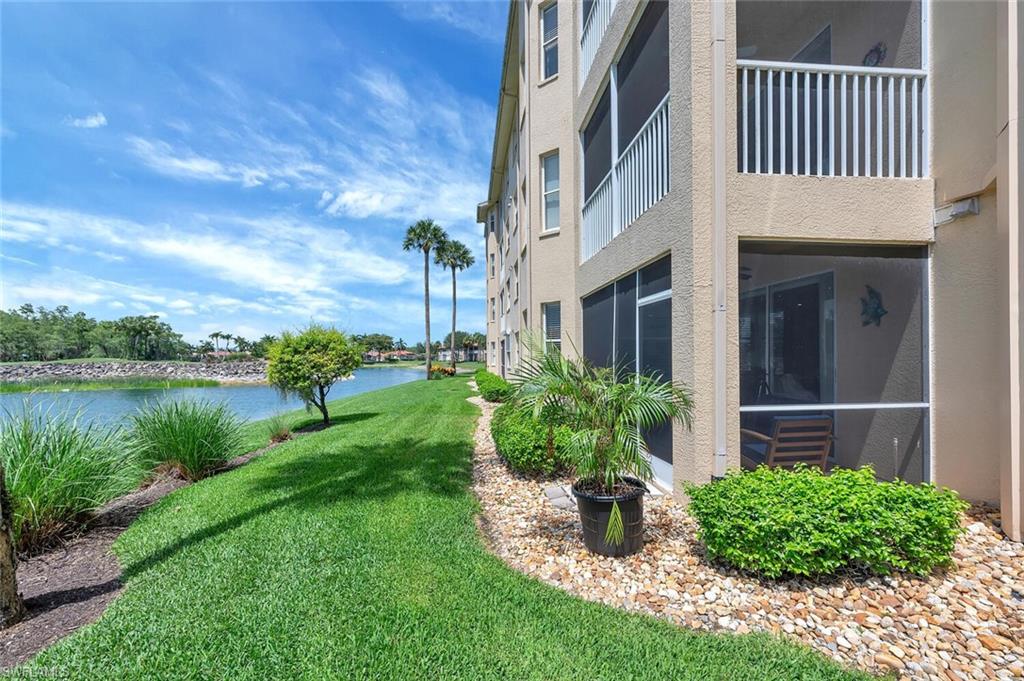 8600 Cedar Hammock Circle, Unit 1313 Naples, FL 34112 - Photo 44 of 48 a front view of a house with garden