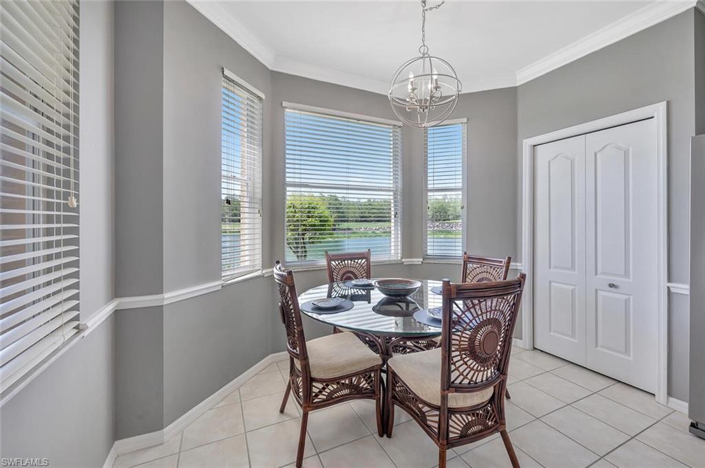 8600 Cedar Hammock Circle, Unit 1313 Naples, FL 34112 - Photo 6 of 48 a view of a dining room with furniture window and outside view