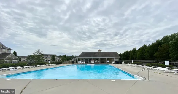a view of a swimming pool with a yard