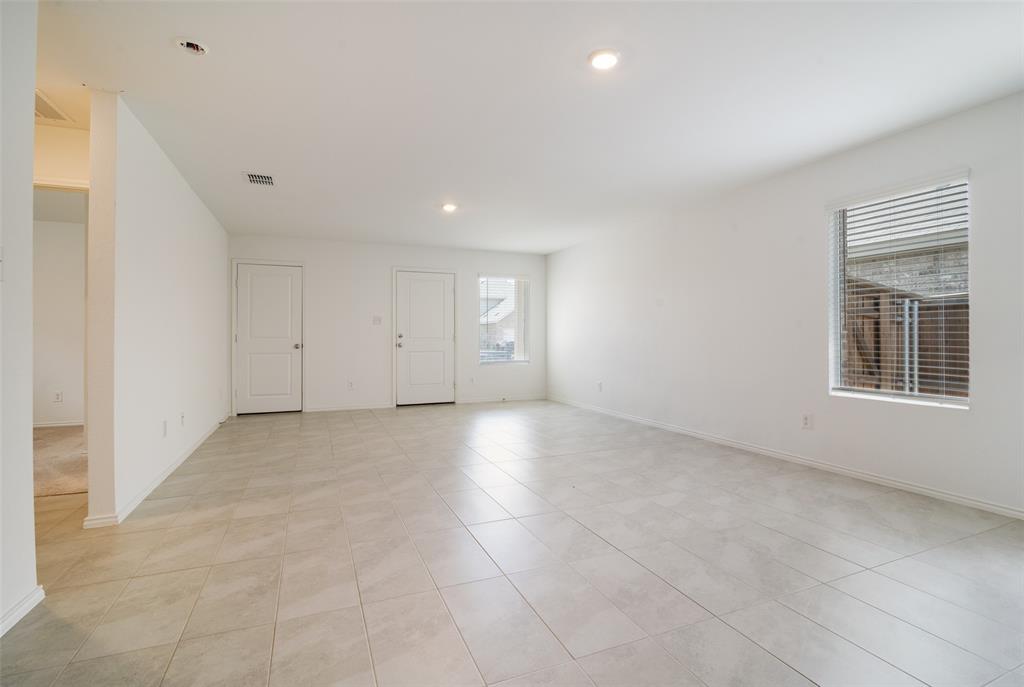 1345 Cider Street Forney, TX 75126 - Photo 3 of 15 a view of empty room with windows
