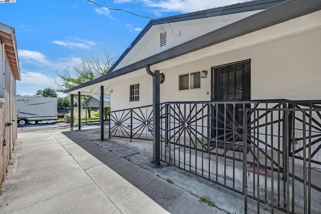 a view of a house with wooden floor roof and deck