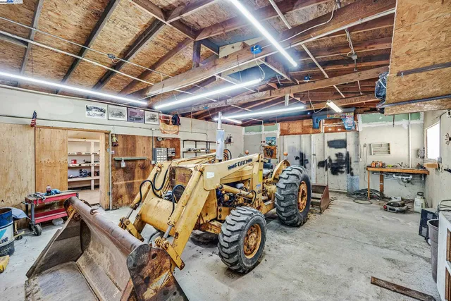 a view of a hallway with dining area and glass door