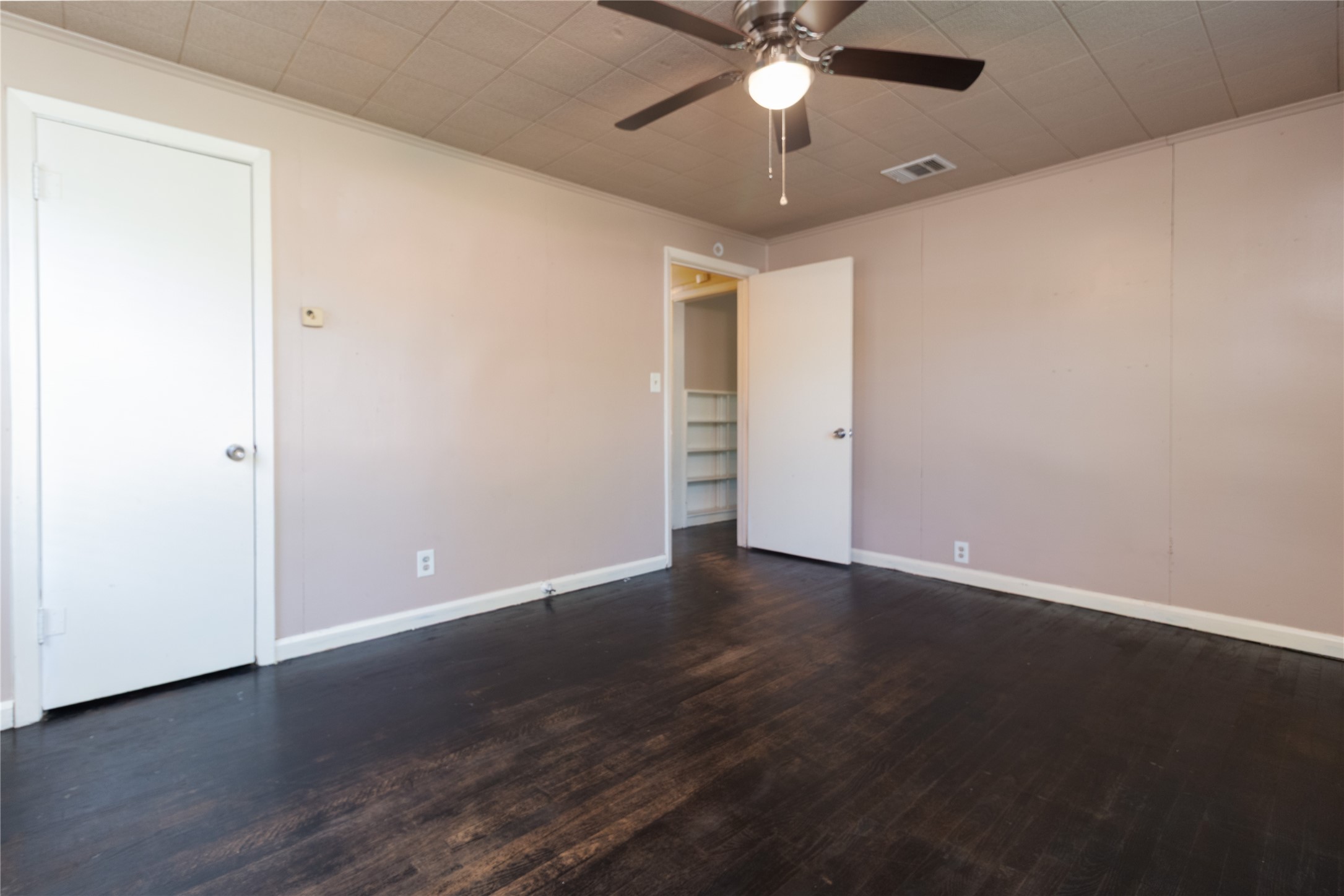 4425 Harding Drive Beaumont, TX 77703 - Photo 11 of 25 an empty room with wooden floor fan and fan