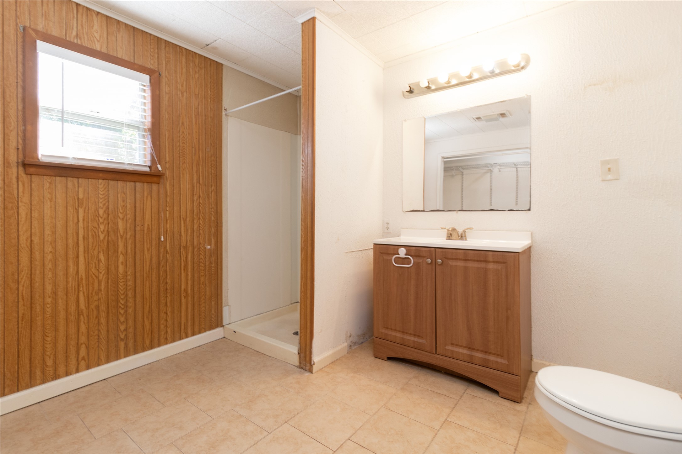 4425 Harding Drive Beaumont, TX 77703 - Photo 14 of 25 a bathroom with a sink a toilet and mirror