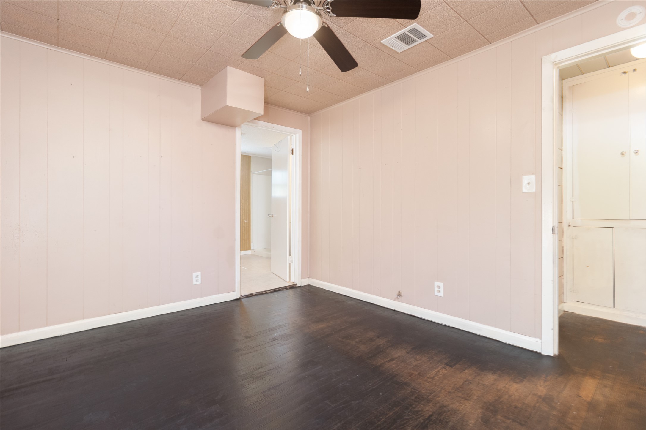4425 Harding Drive Beaumont, TX 77703 - Photo 16 of 25 an empty room with wooden floor fan and window