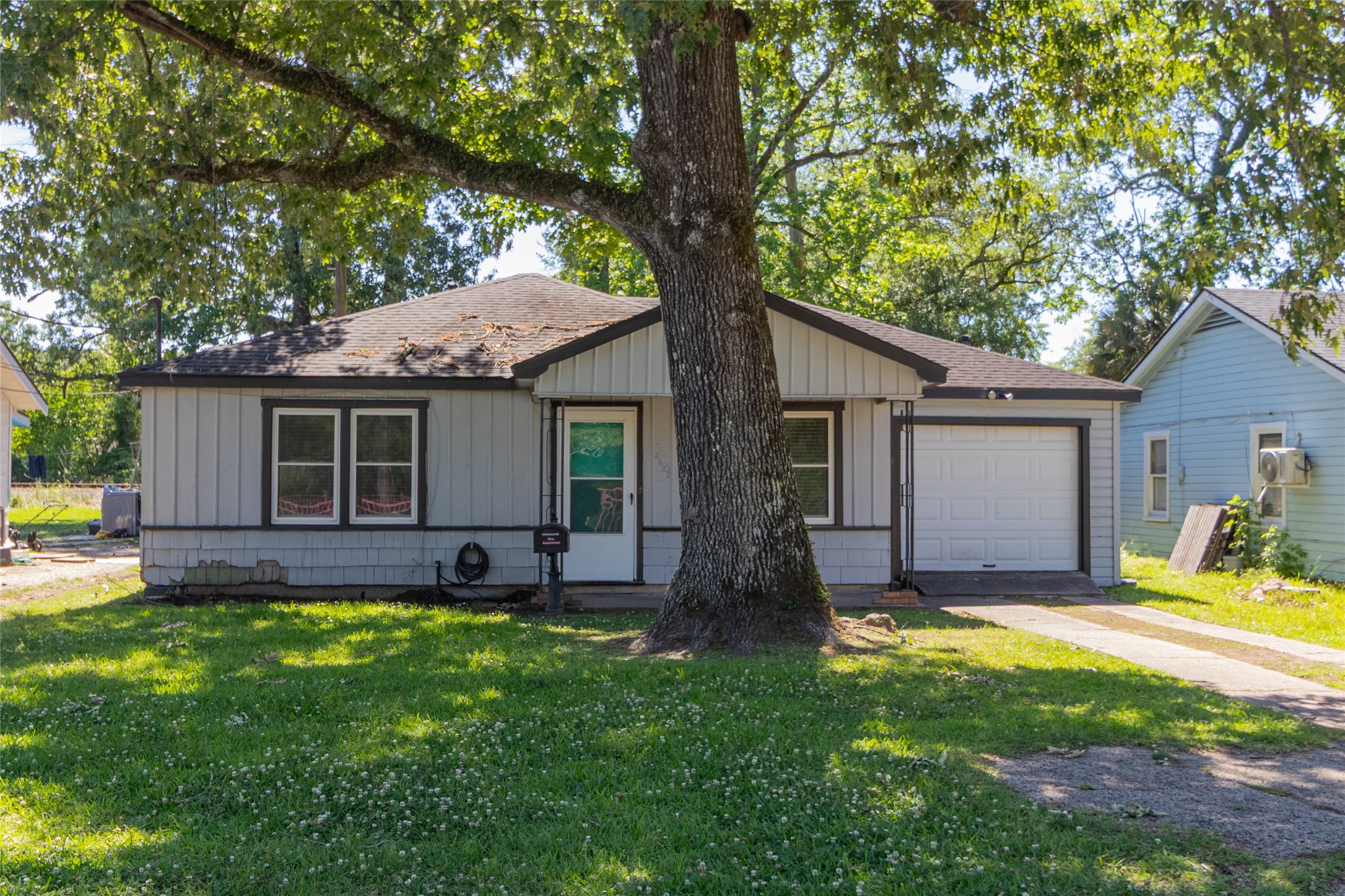 4425 Harding Drive Beaumont, TX 77703 - Photo 2 of 25 a view of a house with a yard and large tree