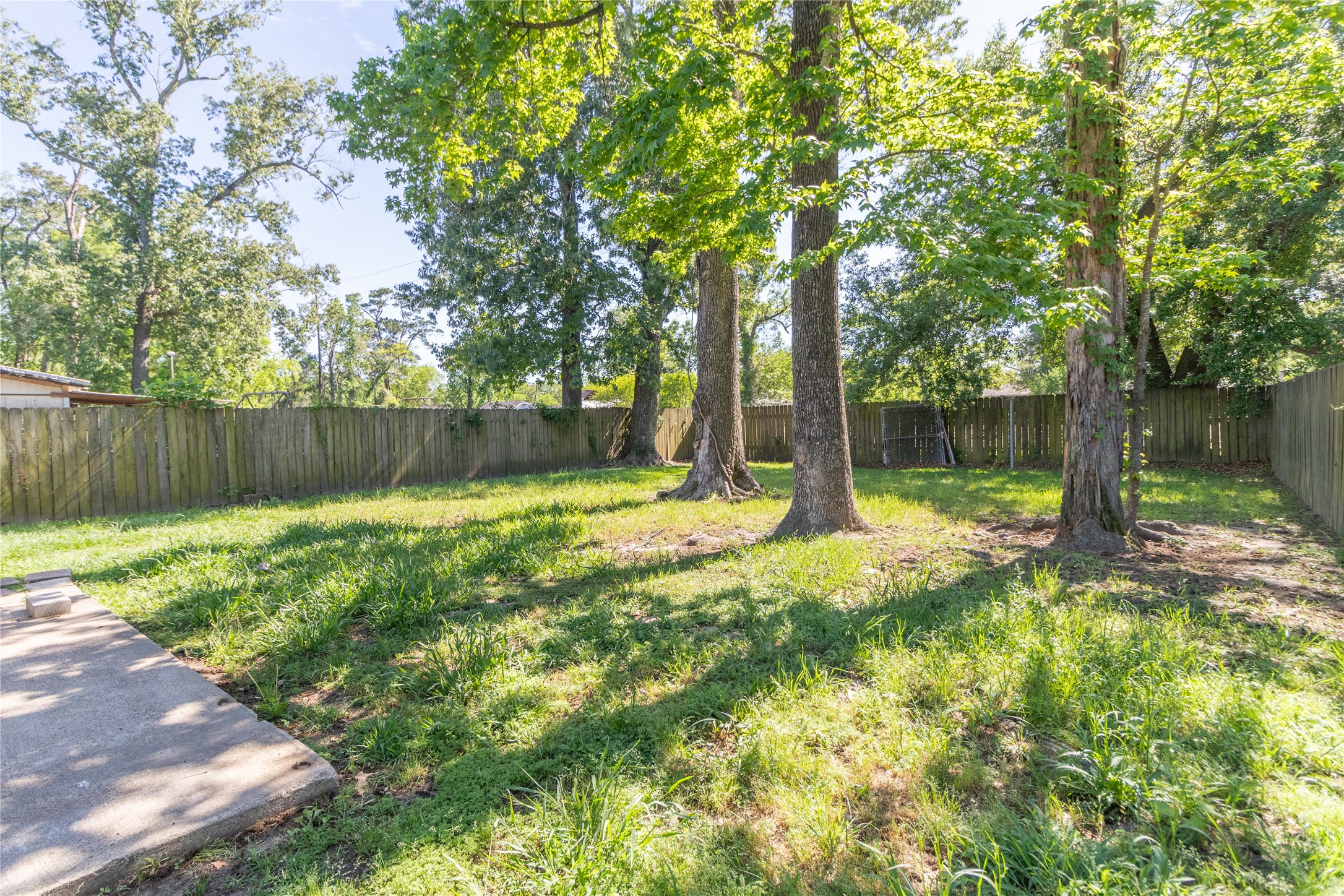 4425 Harding Drive Beaumont, TX 77703 - Photo 22 of 25 a view of a backyard with a small cabin