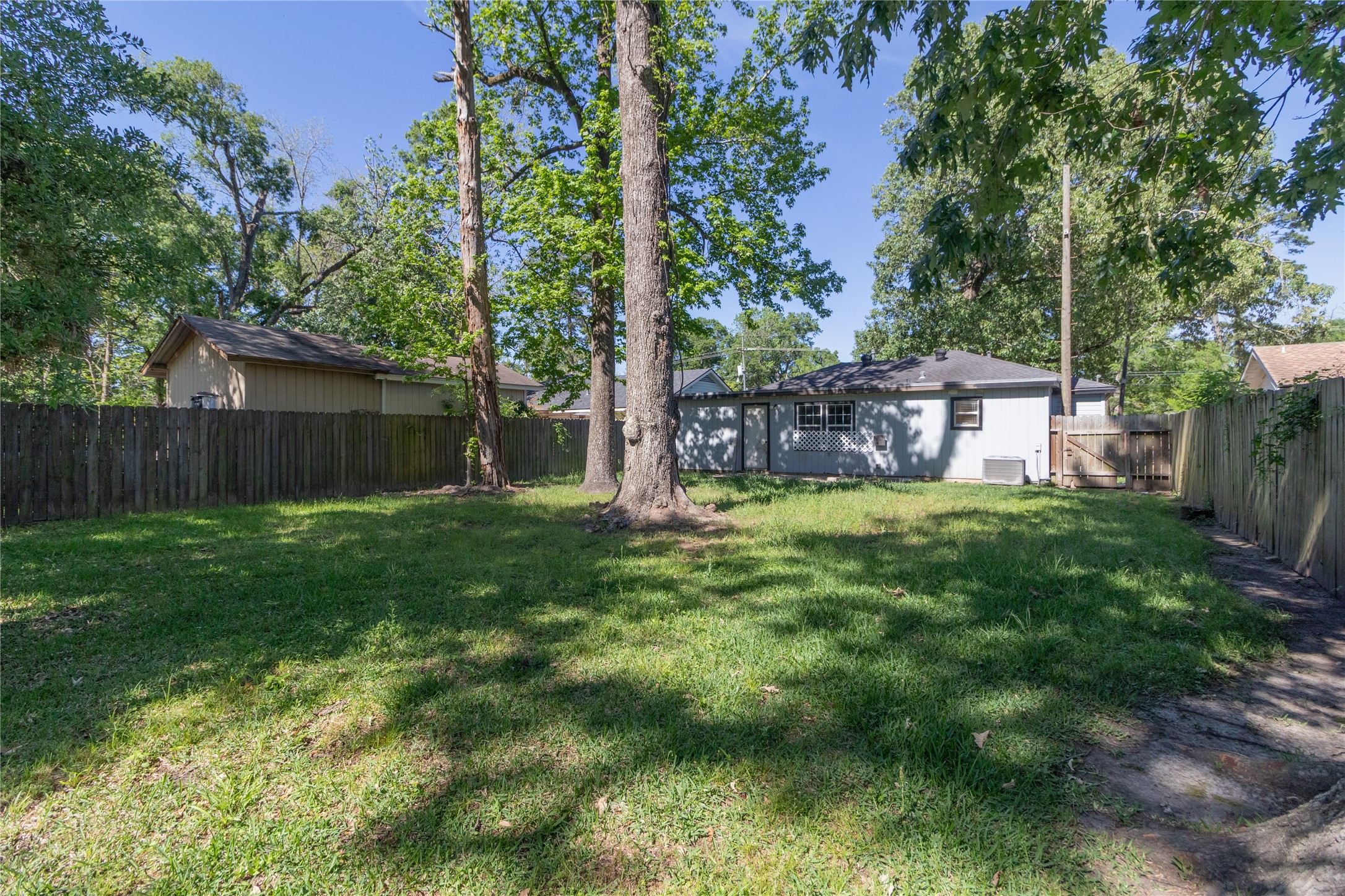 4425 Harding Drive Beaumont, TX 77703 - Photo 24 of 25 a view of a house with a backyard