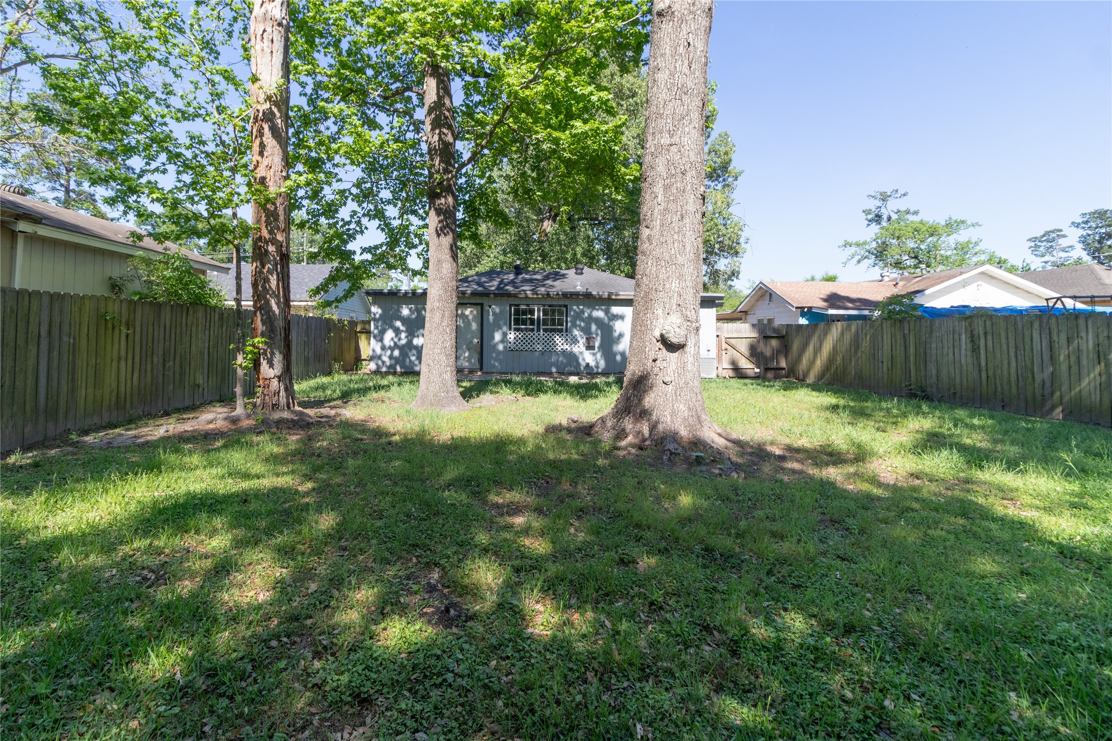 4425 Harding Drive Beaumont, TX 77703 - Photo 25 of 25 a view of a backyard with a garden and trees