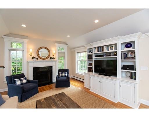 82 Bristol Road Wellesley, MA 02481 - Photo 18 of 26 a living room with furniture a flat screen tv and a fireplace
