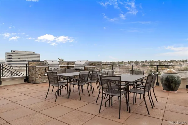 a view of a terrace with furniture and stove