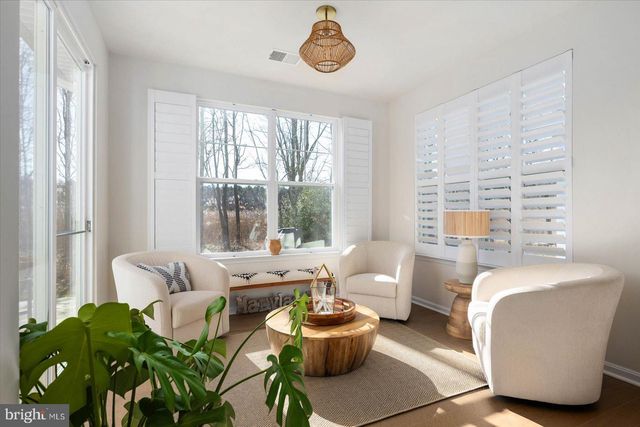 a view of a dining room with furniture and a wooden floor