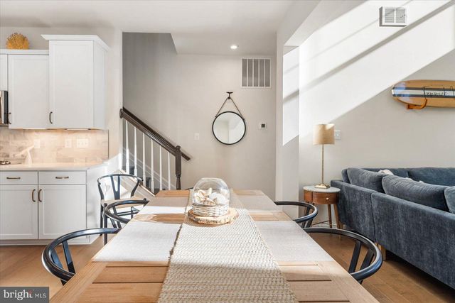 a spacious bedroom with a bed and a large window