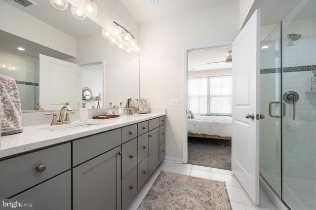 a view of a house with backyard porch and sitting area