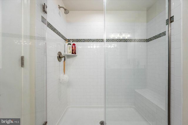 a view of swimming pool with outdoor seating and city view