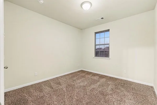 an empty room with a workbench