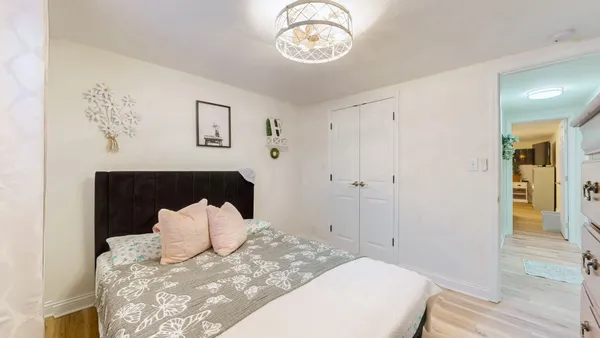 a large white bed in a white room