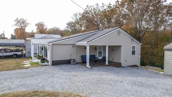 a view of a house with backyard
