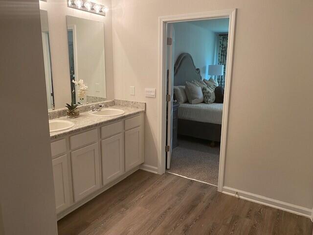 3125 Van Day Way Crestview, FL 32539 - Photo 8 of 24 a en suite bathroom with a sink and mirror