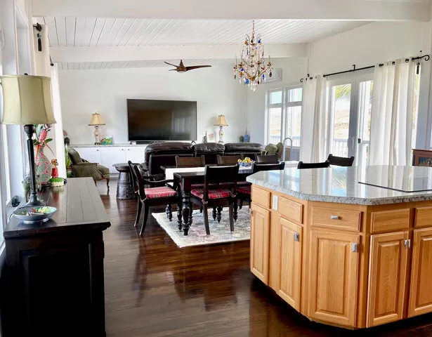 a view of a chairs and table in the balcony