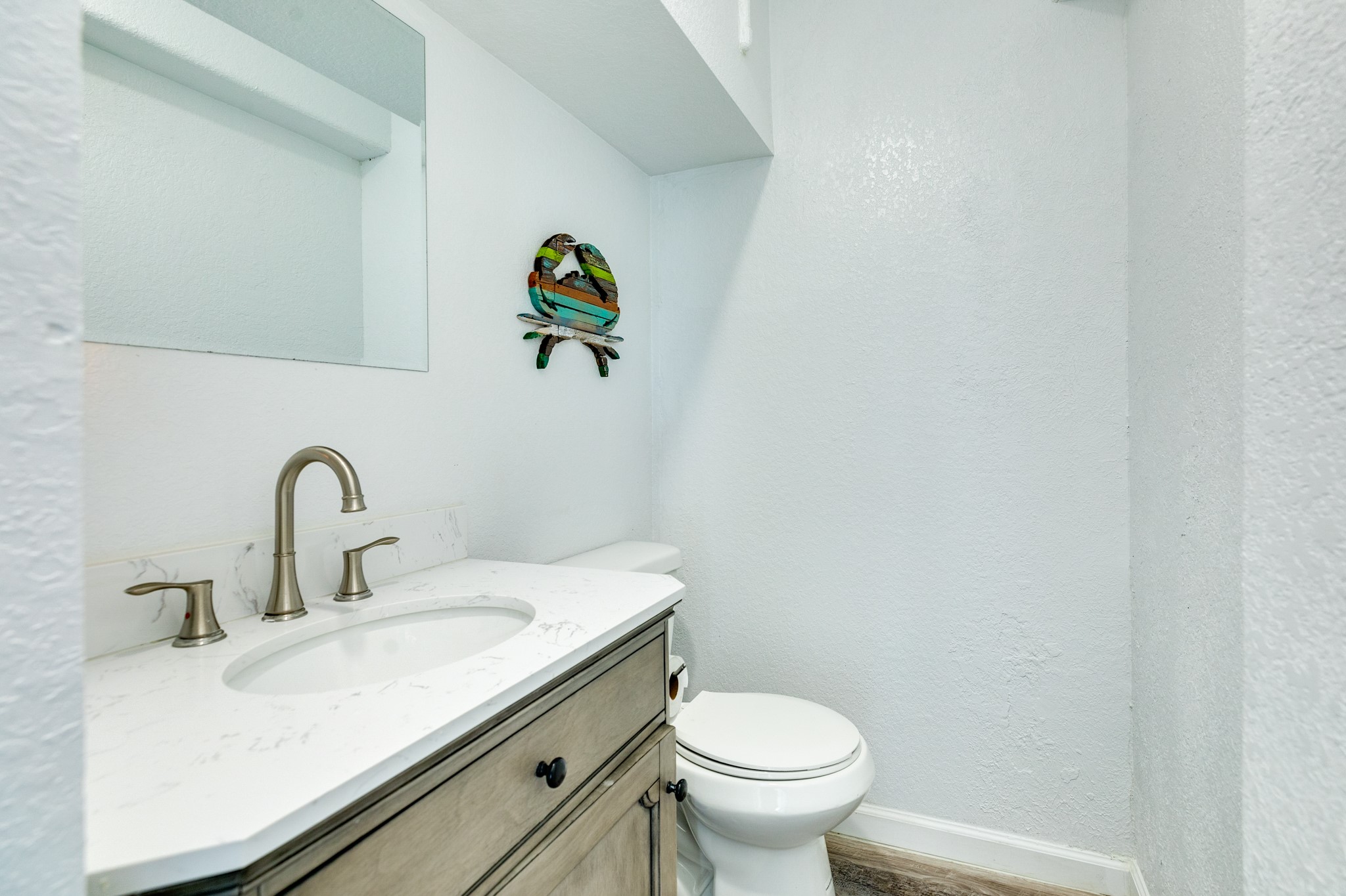 101 Pelican Place, Unit 7 Freeport, TX 77541 - Photo 18 of 44 Convenient half bath located on the main floor.
