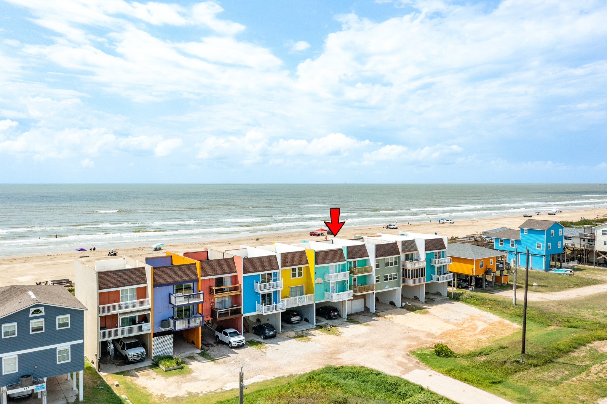 101 Pelican Place, Unit 7 Freeport, TX 77541 - Photo 2 of 44 Prime beachfront property with vibrant, colorful homes offering direct ocean views. Ideal for those seeking coastal living at its finest.