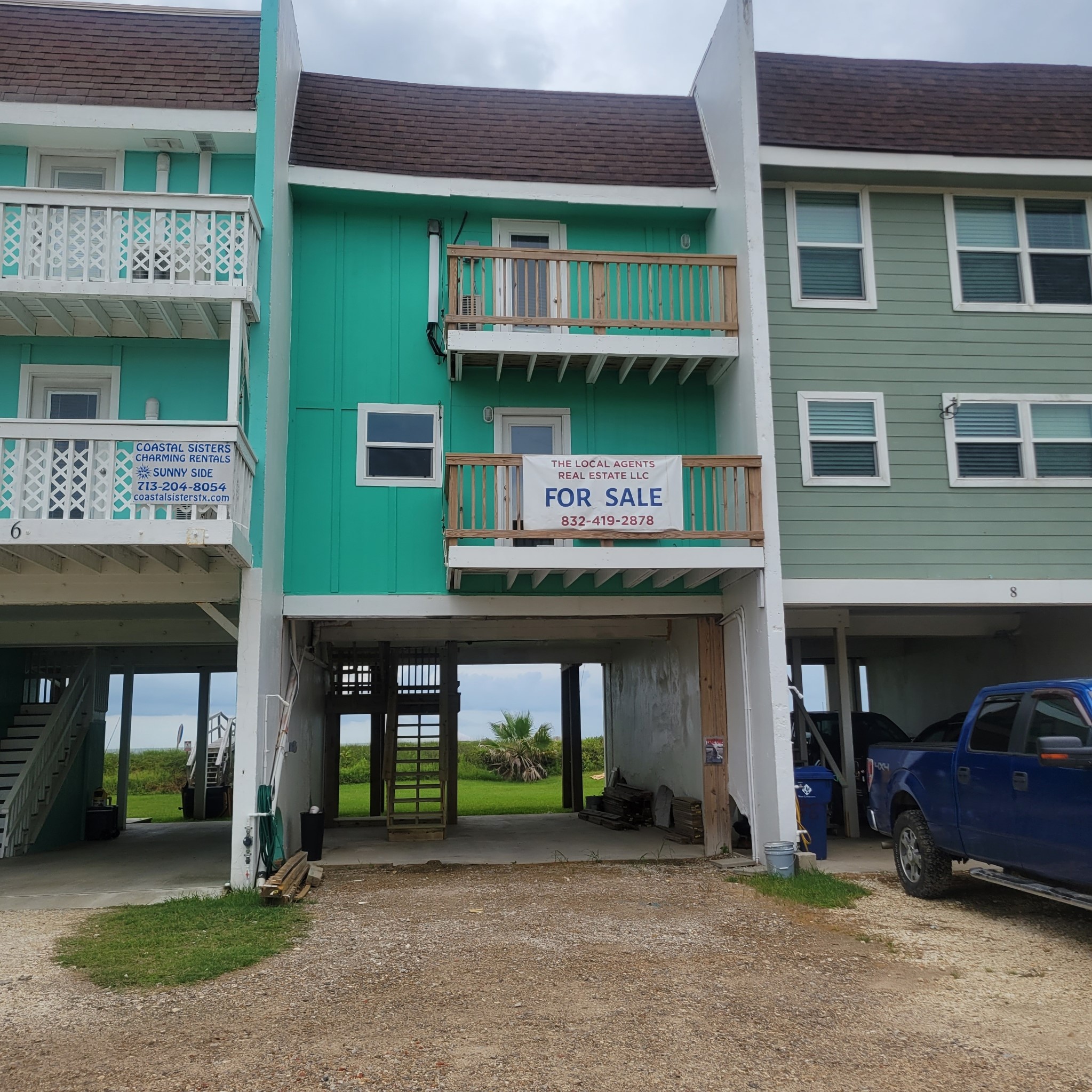 101 Pelican Place, Unit 7 Freeport, TX 77541 - Photo 38 of 44 Charming turquoise beach house with two balconies, covered parking, and ocean views. Ideal for those seeking a coastal lifestyle. For sale by local real estate agency.