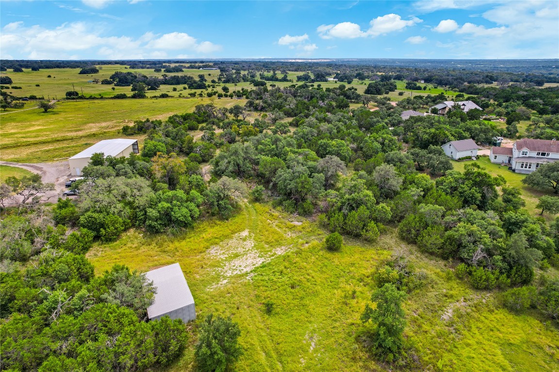 714 Abbey Road Liberty Hill, TX 78642 - Photo 1 of 1 a view of a yard with swimming pool and outdoor seating