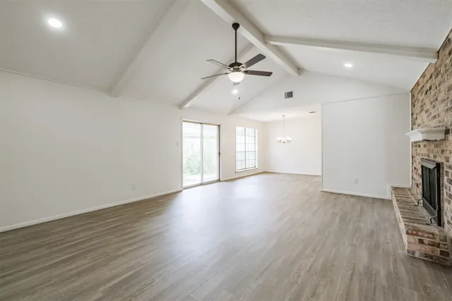 a view of livingroom with hardwood floor and a ceiling fan