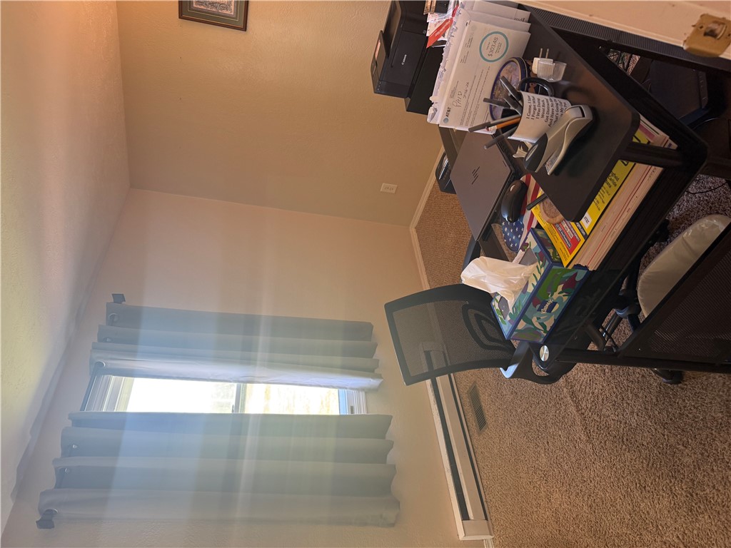 5840 Pitchin Road South Springfield, OH 45502 - Photo 14 of 18 This versatile room offers a comfortable and functional space for work or leisure with carpeted flooring.