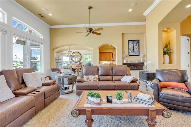 a kitchen with stainless steel appliances granite countertop a sink dishwasher and cabinets with wooden floor
