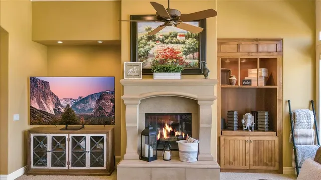 a kitchen with granite countertop a sink a stove and cabinets