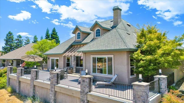 a bedroom with furniture and a large window