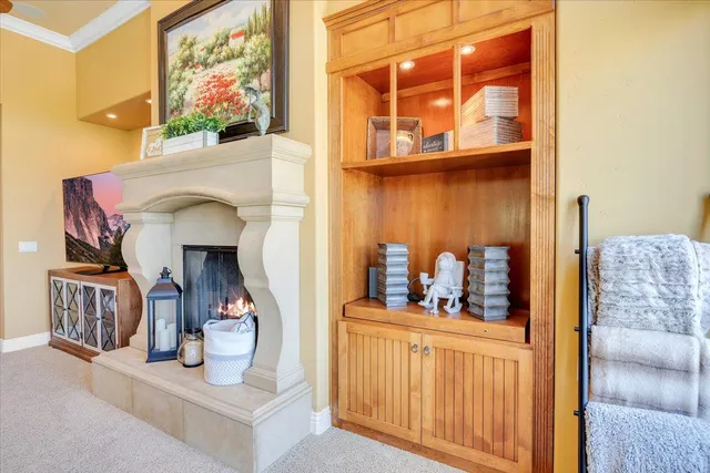 an aerial view of a house with a yard and large tree
