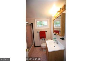 12924 Georgia Avenue Silver Spring, MD 20906 - Photo 16 of 19 a bathroom with a sink and a mirror