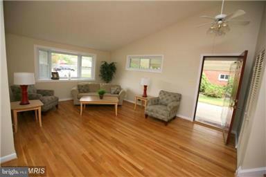 12924 Georgia Avenue Silver Spring, MD 20906 - Photo 2 of 19 a living room with furniture and a large window