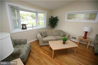 12924 Georgia Avenue Silver Spring, MD 20906 - Photo 3 of 19 a living room with furniture and a window