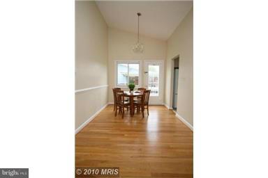12924 Georgia Avenue Silver Spring, MD 20906 - Photo 5 of 19 a view of a dining room with furniture and a chandelier