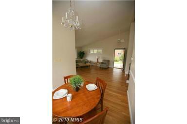 12924 Georgia Avenue Silver Spring, MD 20906 - Photo 6 of 19 a view of a living room with a table and chairs