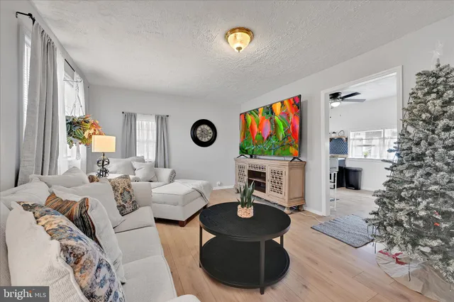 a living room with furniture and a table