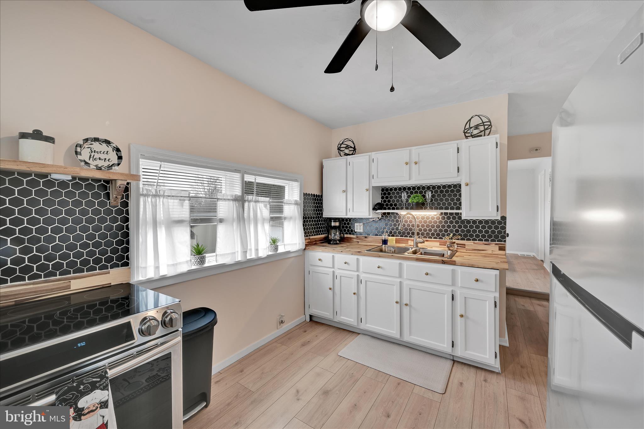 1428 Meade Street Reading, PA 19607 - Photo 15 of 29 a kitchen with counter top space cabinets and stainless steel appliances