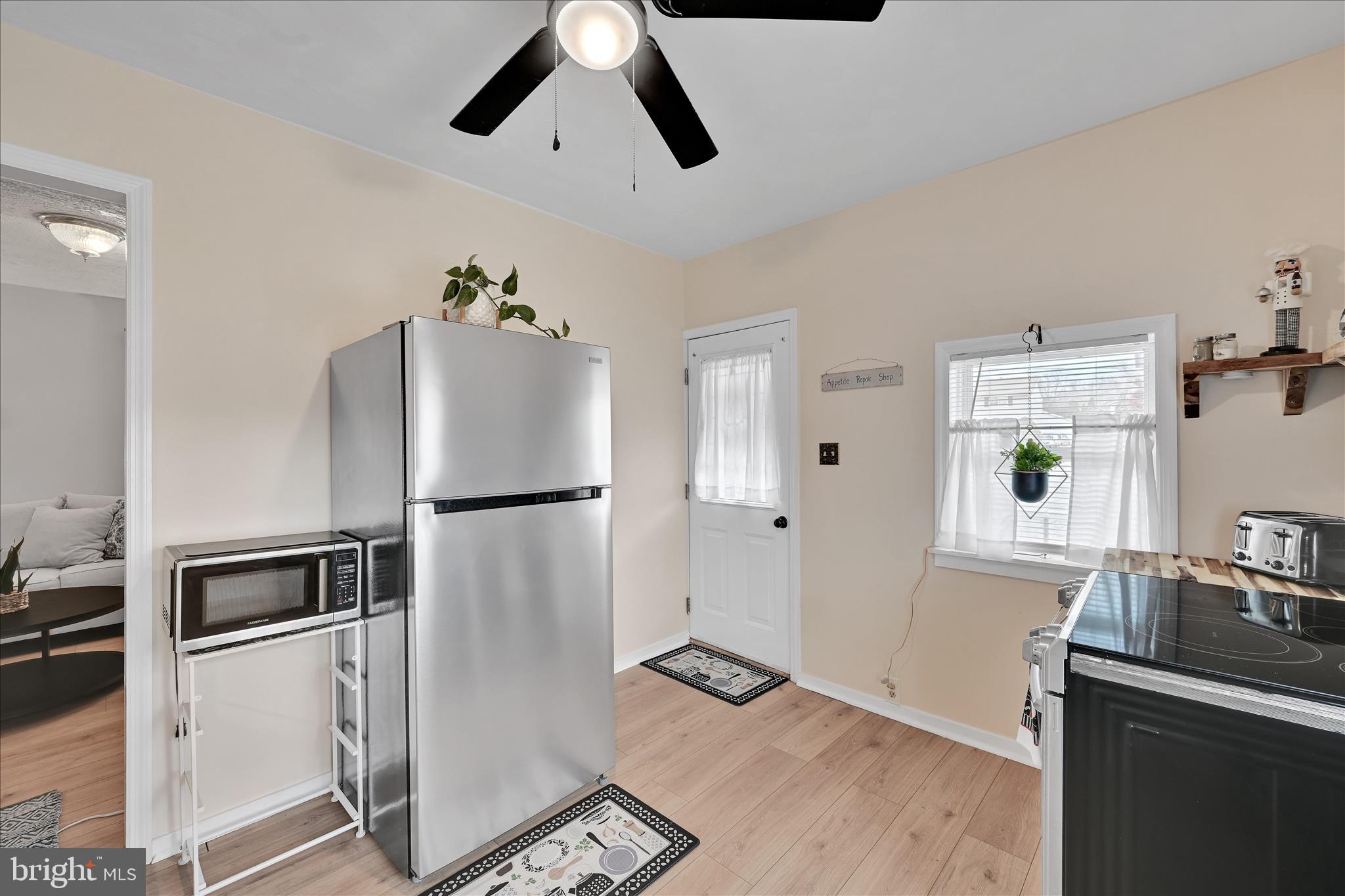 1428 Meade Street Reading, PA 19607 - Photo 18 of 29 a kitchen with stainless steel appliances granite countertop a refrigerator and a stove