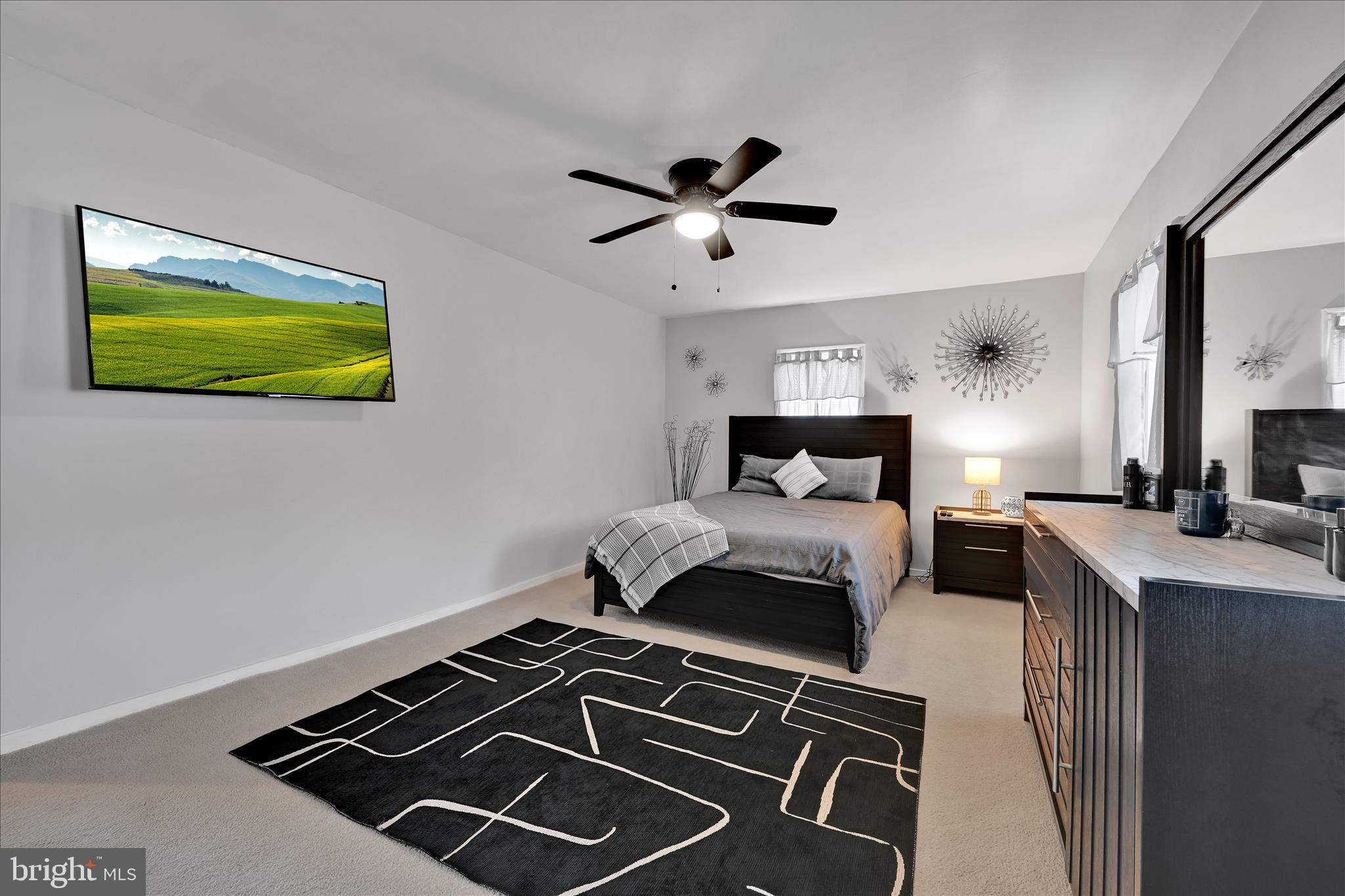1428 Meade Street Reading, PA 19607 - Photo 20 of 29 a bedroom with a bed and a painting on the wall